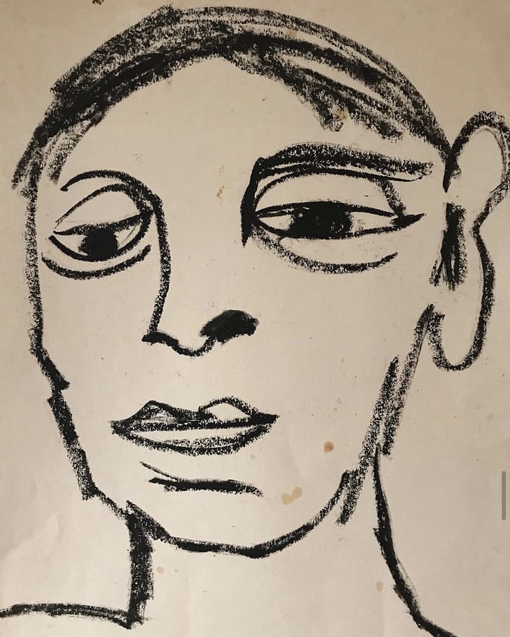 Dessin au pastel gras d'un visage.